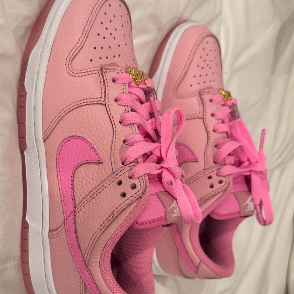 Nike Women's Pink Sneakers with Gold Detail